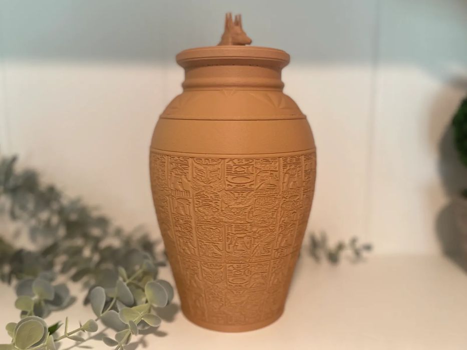 Vaso Egípcio Antigo com Tampa de Anúbis
