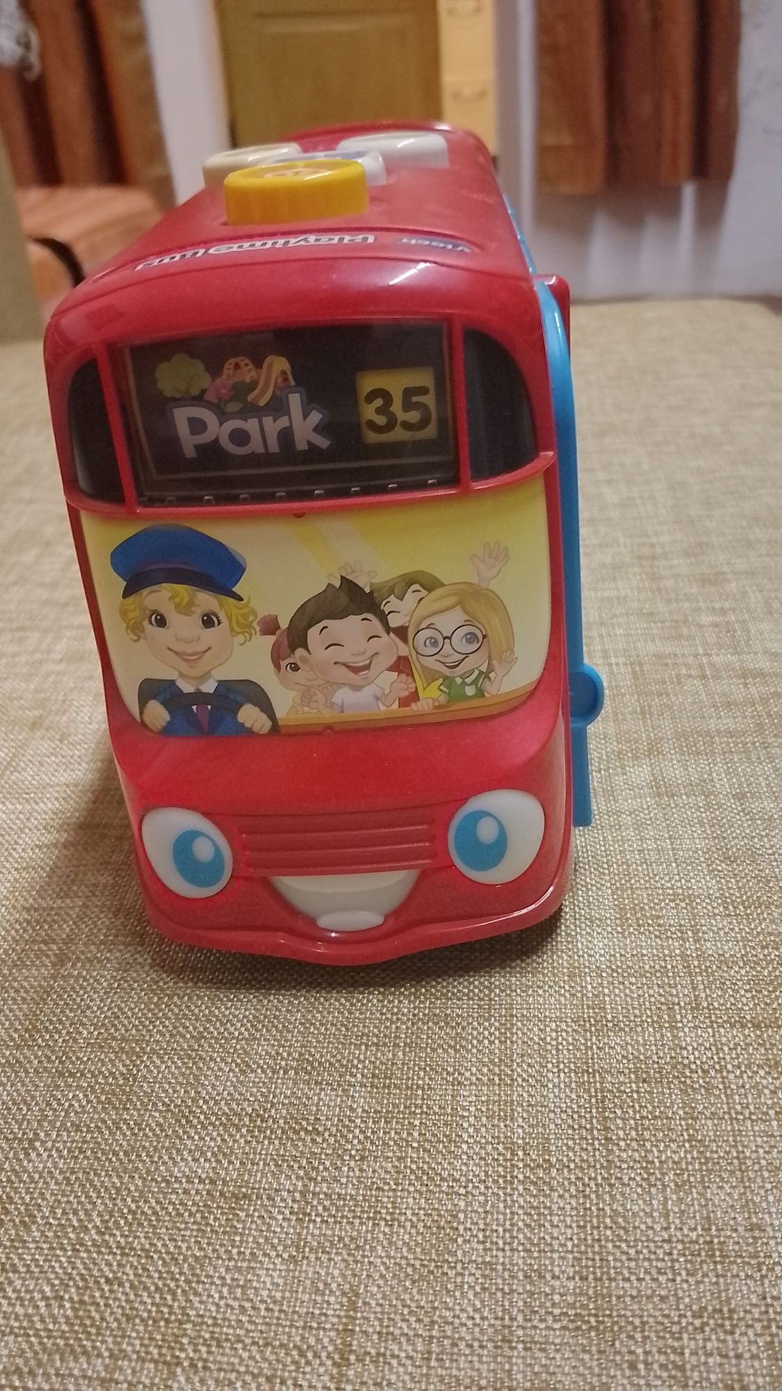Игрушка музыкальная автобус