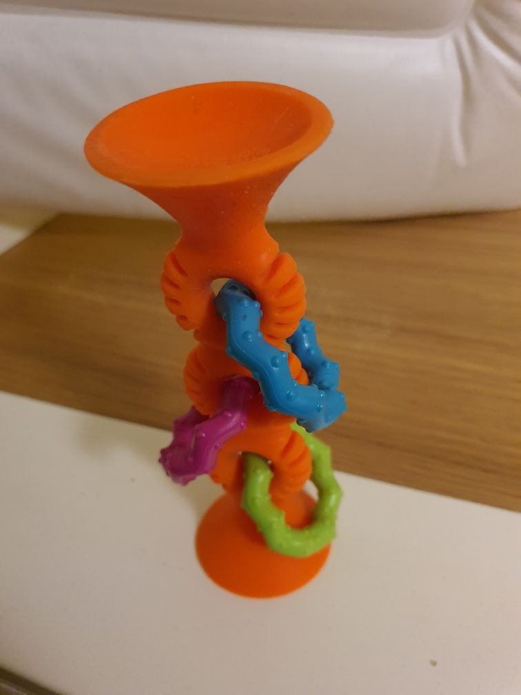 Fat Brain Toys zabawka sensoryczna pipSquigz Loops pomarańczowa