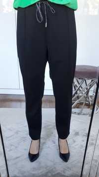 Spodnie damskie materiałowe czarne z przeszyciami XL