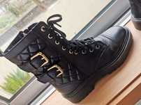 Botas mango em pele