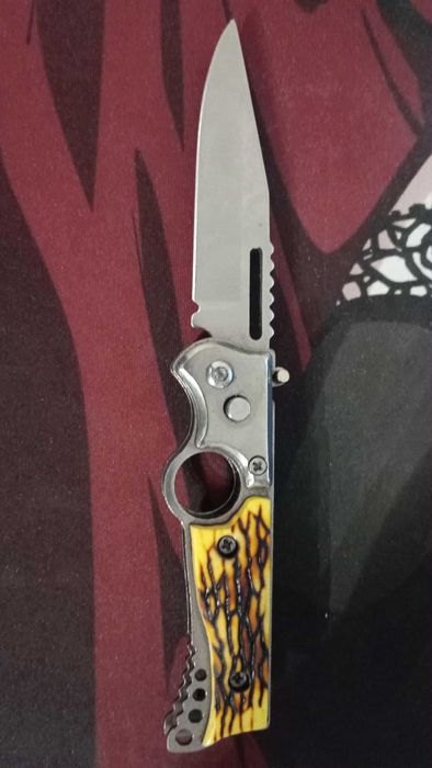 Nóż składany sprężynowy