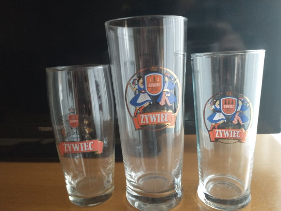 Trzy szklanki z Browaru Żywiec o różnej pojemności