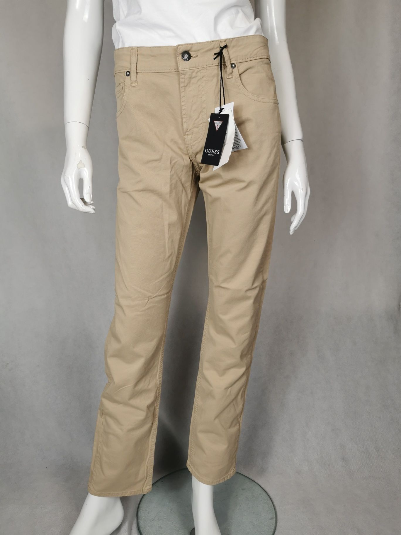 Nowe oryginalne eleganckie spodnie Guess W32 L32 beżowe
