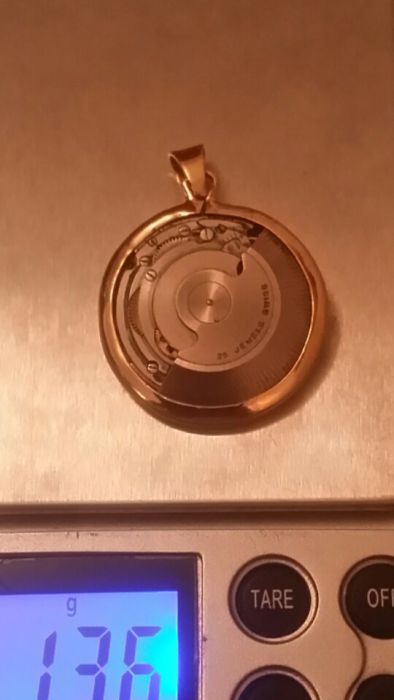 Pendente em ouro 18kt,c/ máquina swiss nade,peso total ,13.6 gr,único