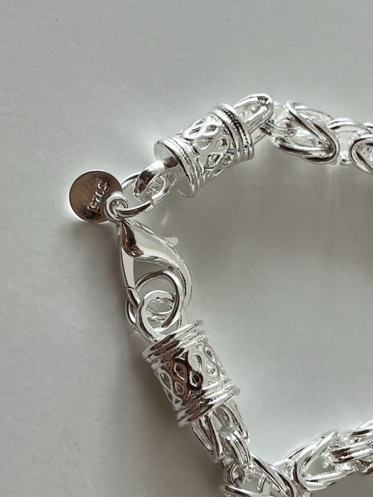 Srebrny stalowy łancuch splot królewski