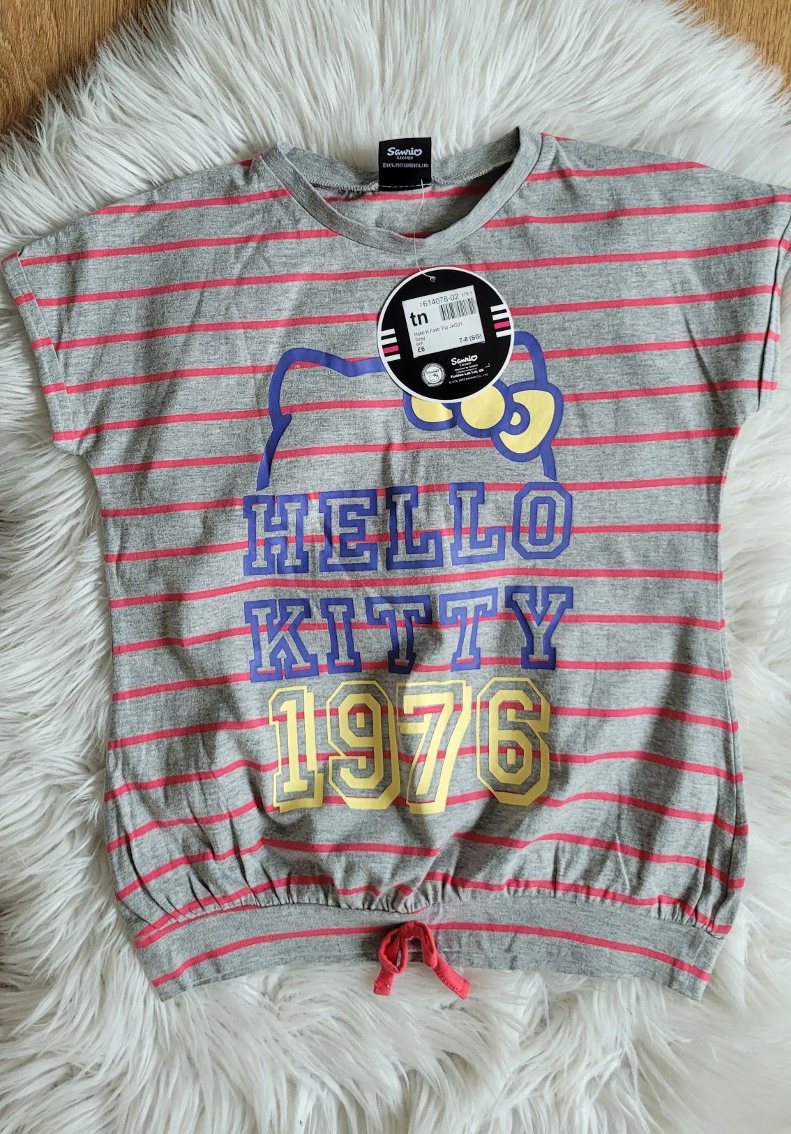 nowy z metką komplet koszulka i spódniczką Hello Kitty na 7-8 lat