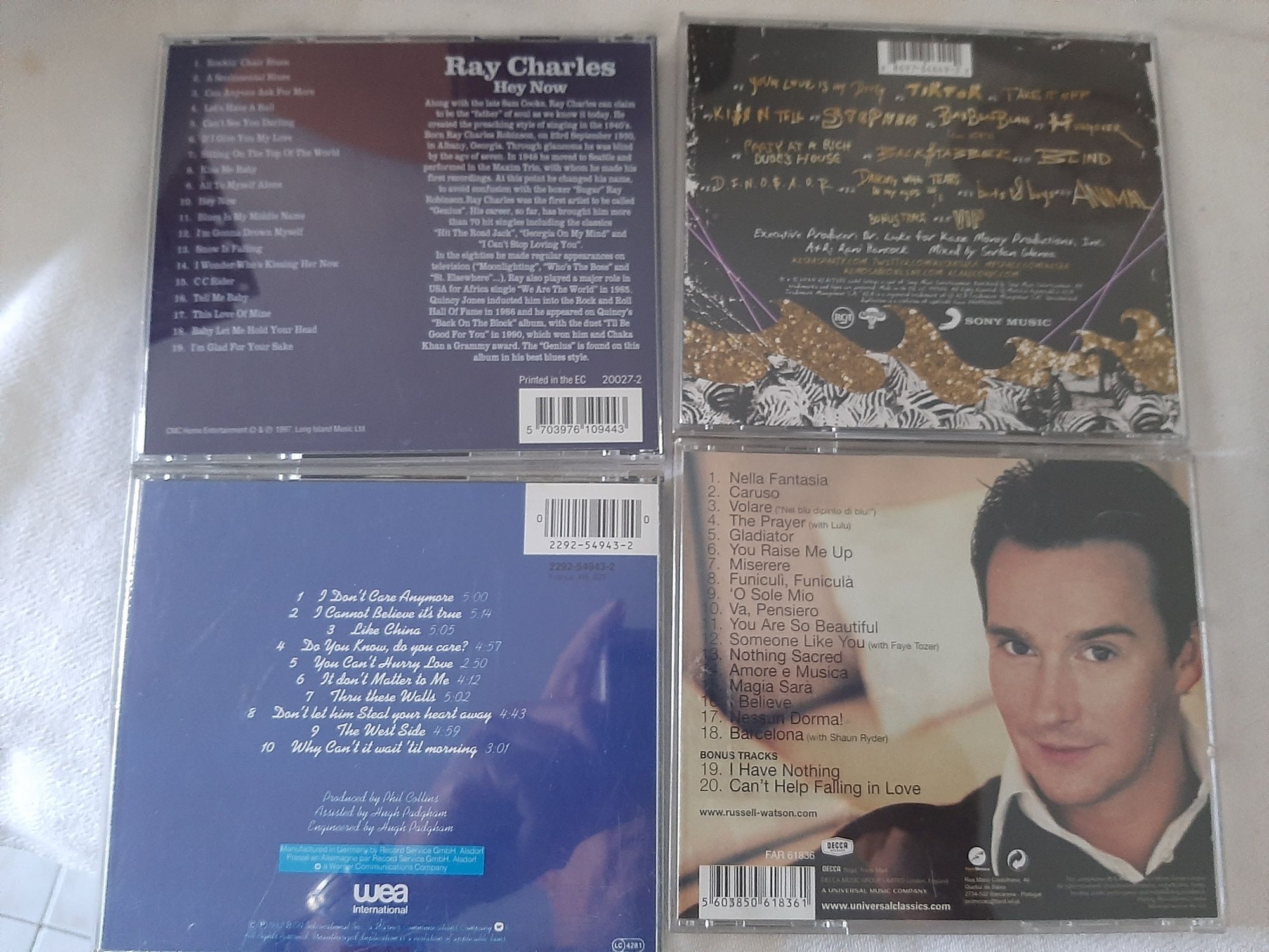 C. d. música originais como novos
