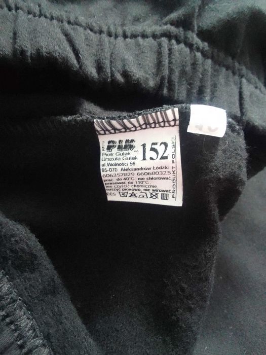 Ocieplane czarne legginsy z brązowym kotem marki PIK rozmiar 152