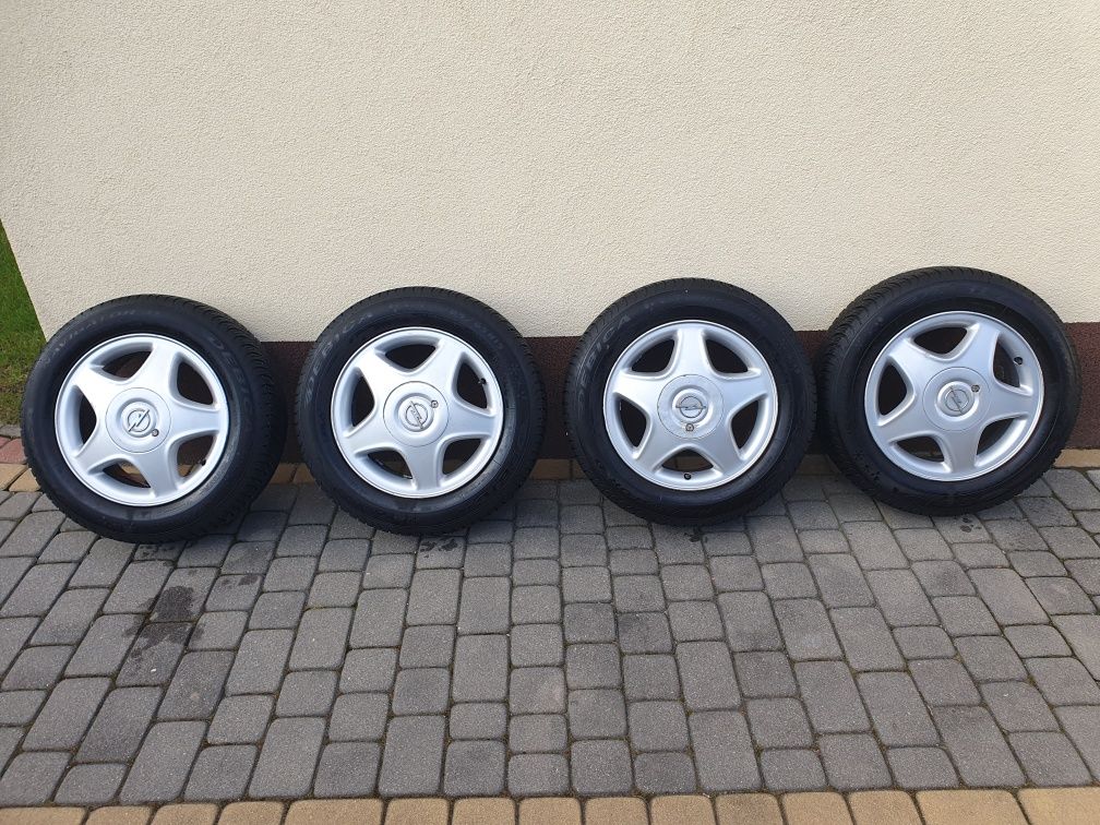 oryginalne alufelgi 15 '' Opel 4x100 + opony wielosezonowe - jak nowe