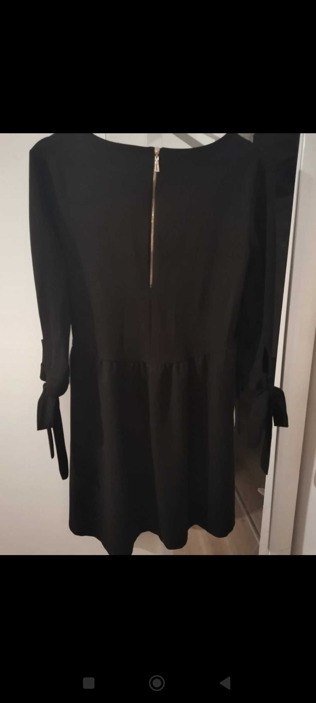 Czarna elegancka sukienka kokardy maskująca brzuch M 38