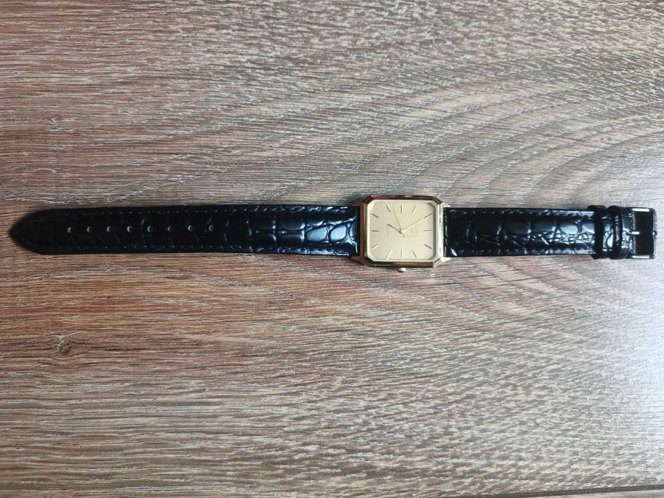 Sprzedam złocony męski zegarek garniturowy Deloitte & Touche