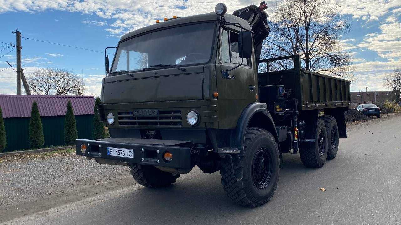 КАМАЗ 4310, бортовий з маніпулятором