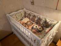 Дитяче ліжечко з маятником для новонародженого