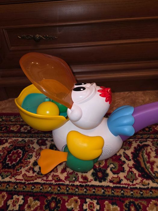 Іграшка музична  каталка Пелікан