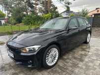 Czarne BMW 318 kombi 2.0 diesel 143 KM