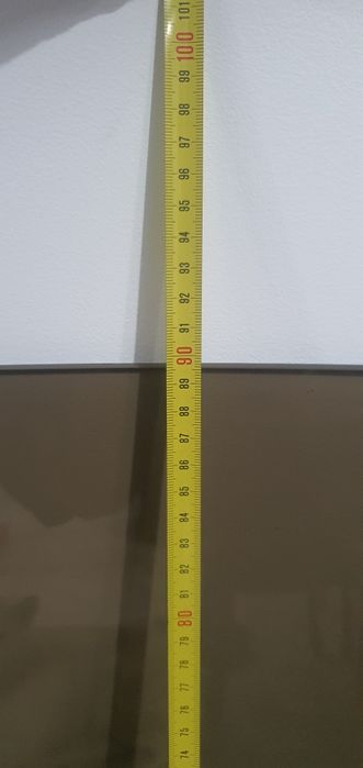 Tampo de mesa em vidro temperado fumê.