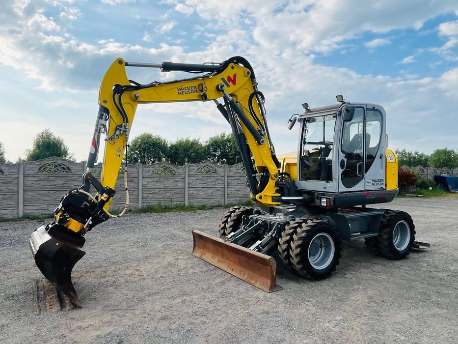 Wacker Neuson EW 100 / ROTOTILT / 4 Łyżki + Widły / Plug + Podpory / Sprowadzona / Koparka Kołowa  Stan bardzo dobry, Maszyna sprowadzona, rototilt