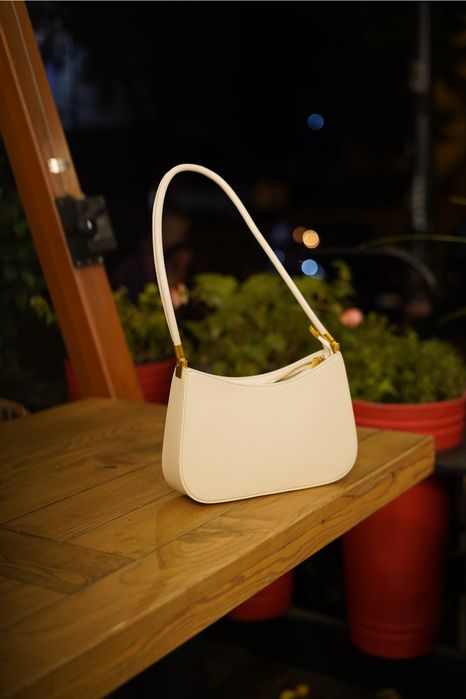 Шкіряна сумка молочного кольору