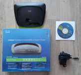 Router Cisco Linksys model WAG120N, oraz router Sagem Fast 2704 Orange