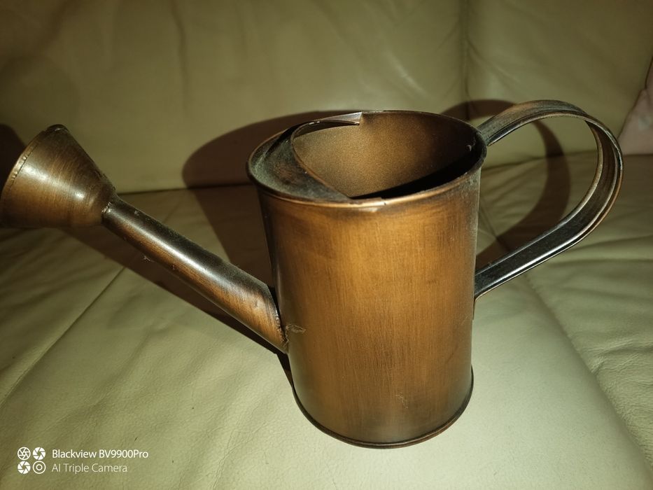 Pequeno regador como novo