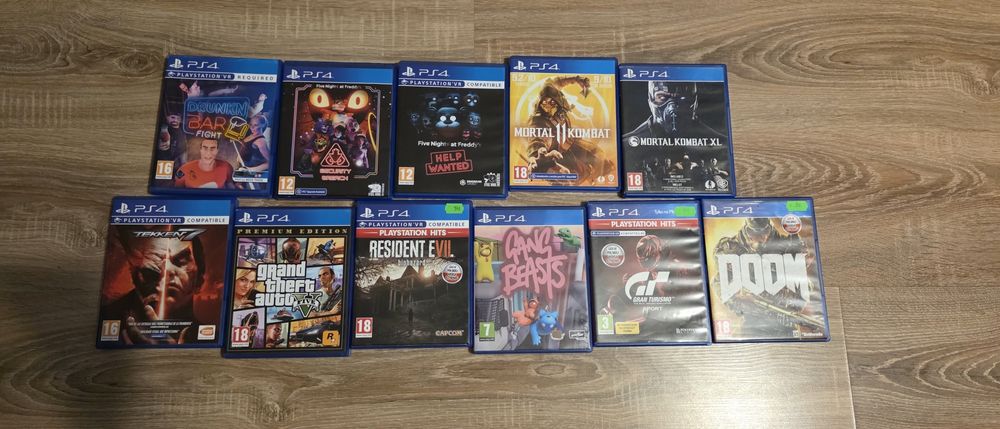 Konsola PS4+VR+stacja ladowania+dysk+kierownica+pistolet+11gier