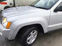 Błotnik przedni lewy srebrny PS2 Jeep grand Cherokee WK WH