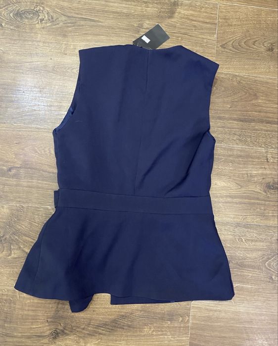 Отдам бесплатно новую синюю жилетку