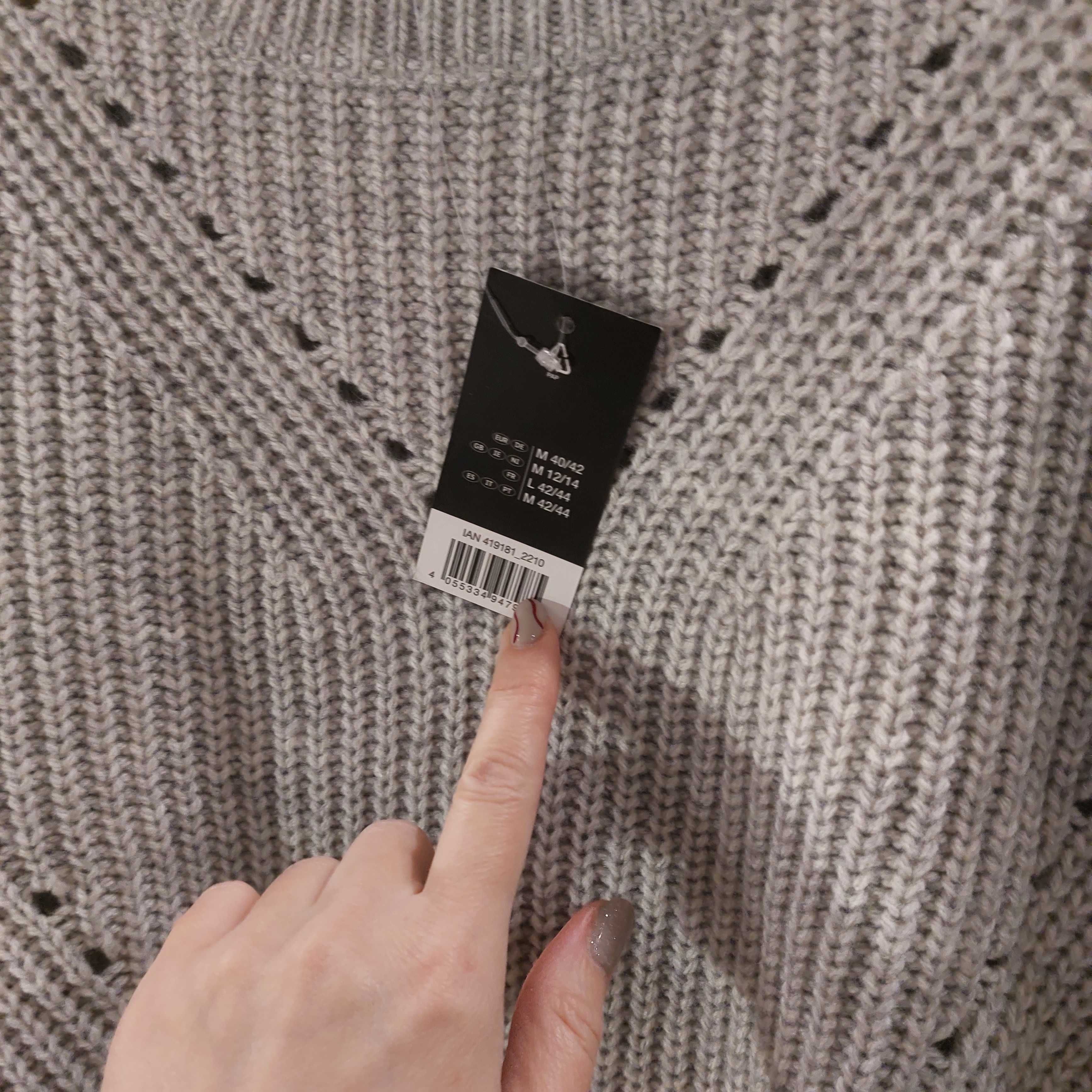 Nowy efektowny sweterek z ozdobnym ażurkiem