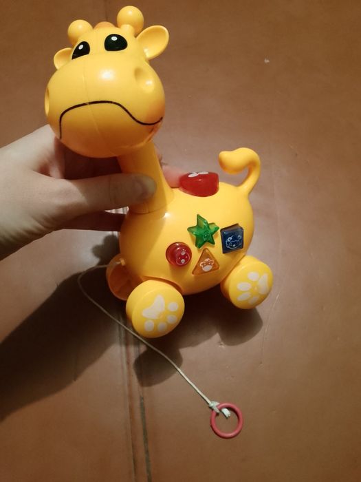 Іграшка каталка музична "Жираф"