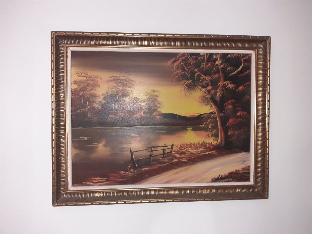 Quadro paisagem com moldura dourada