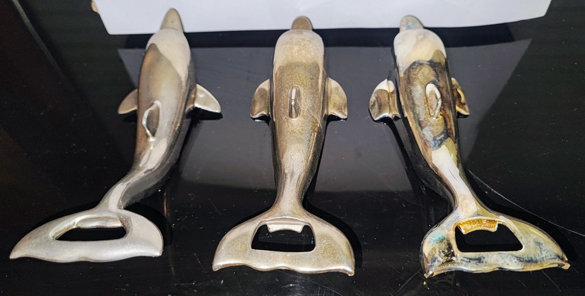 Metalowe otwieracze "delfin"