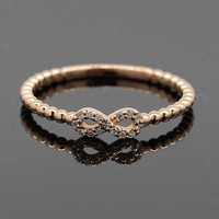 Złoty pierścionek z diamentami nieskończoność różowe złoto 14K