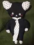 Peluche preto com um cachecol
