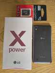 Smartfon LG power K220 + ładowarka + karta pamięci