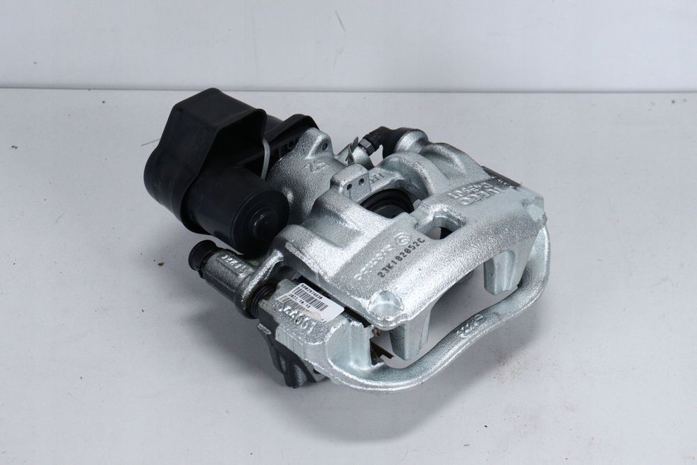 Zacisk hamulcowy lewy tył elektryczny ręczny Iveco Daily 19- S35 NOWY ORG