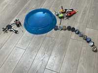Дитячі іграшки «Бейблейди» та арена для їх запуску