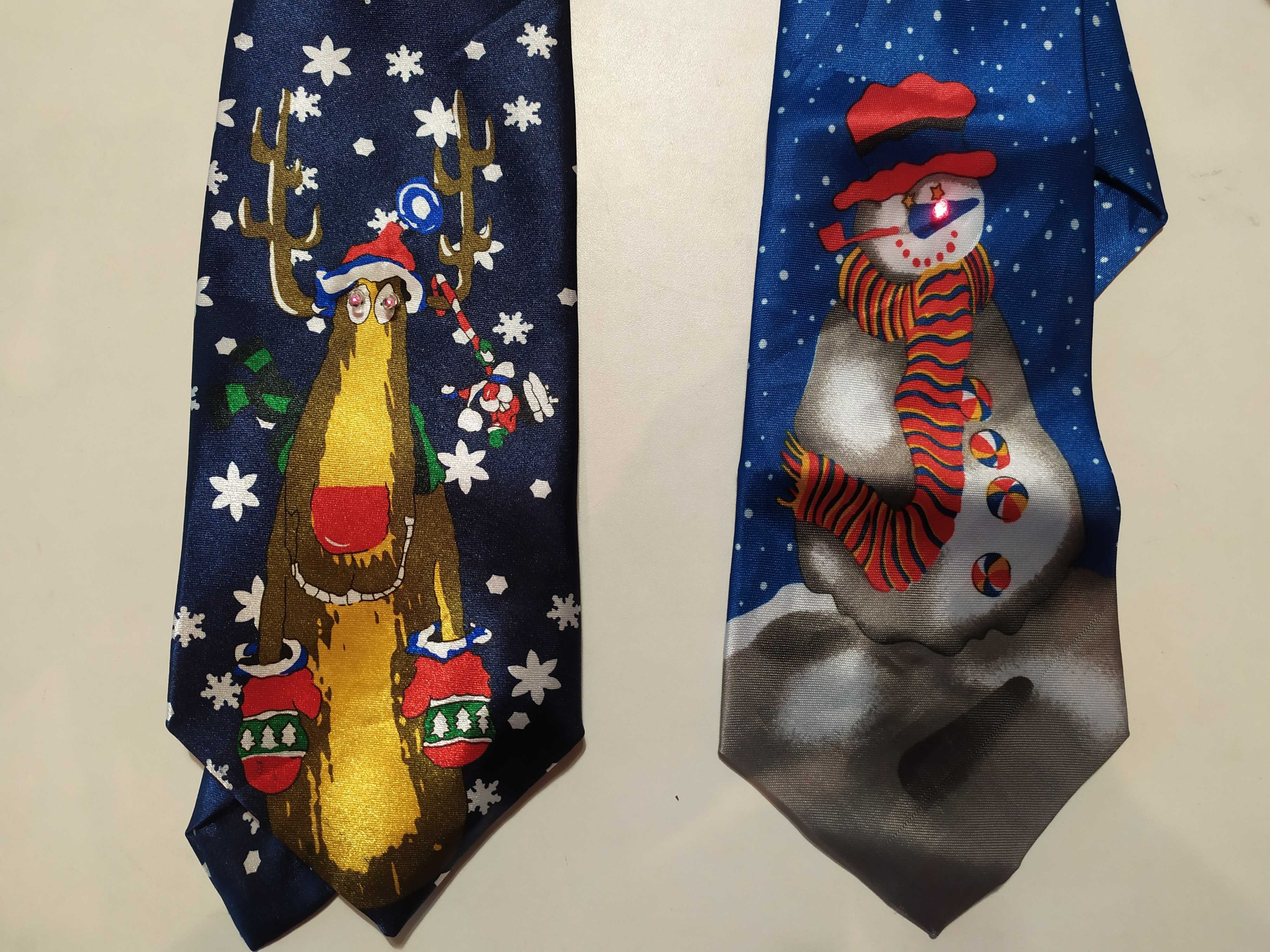 Новорічні товари:краватка(галстук)світлові ефекти,музика,брелок Санта