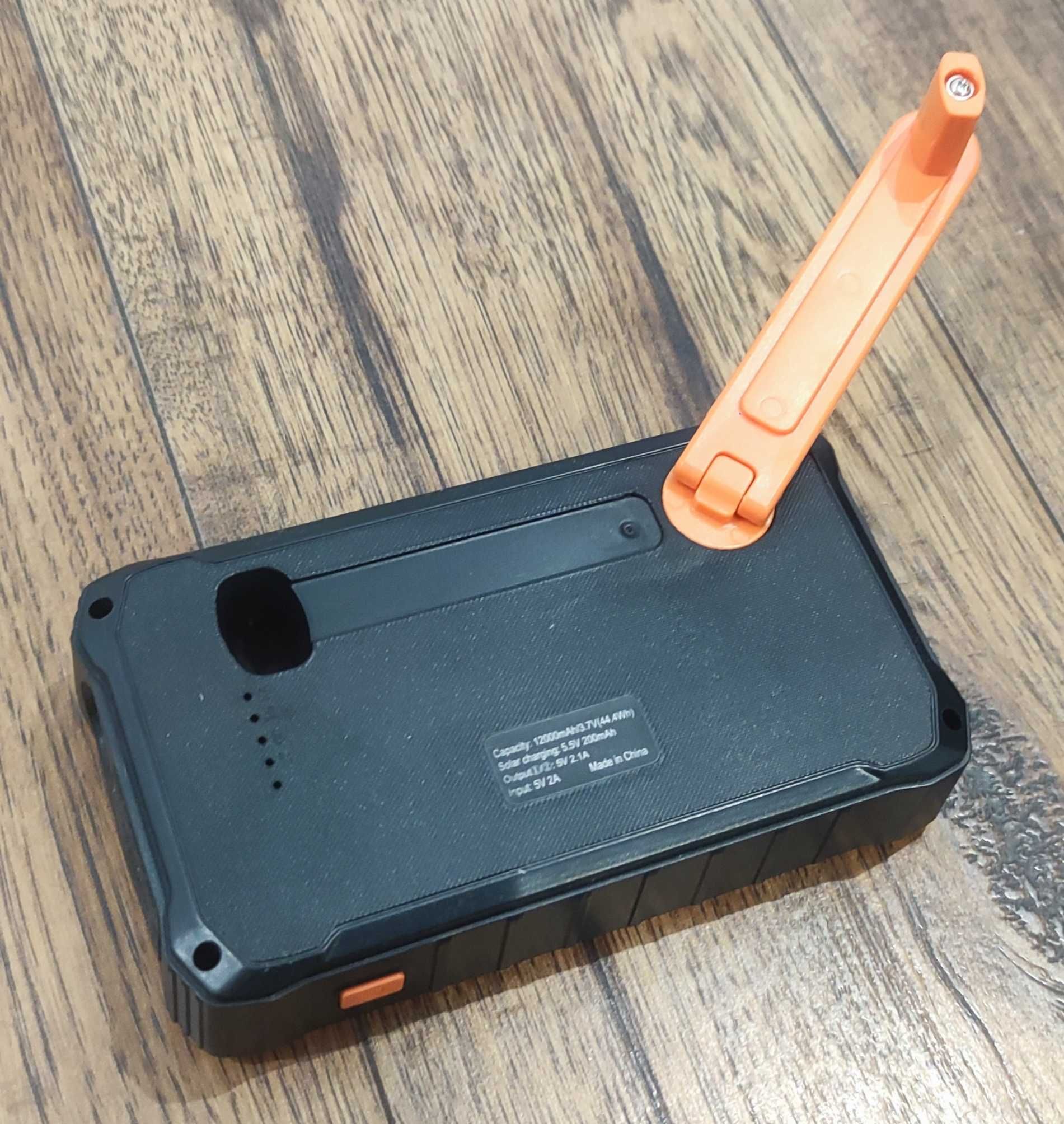 Powerbank solarny na korbkę 12.000 mAh pomarańczowy, nowy