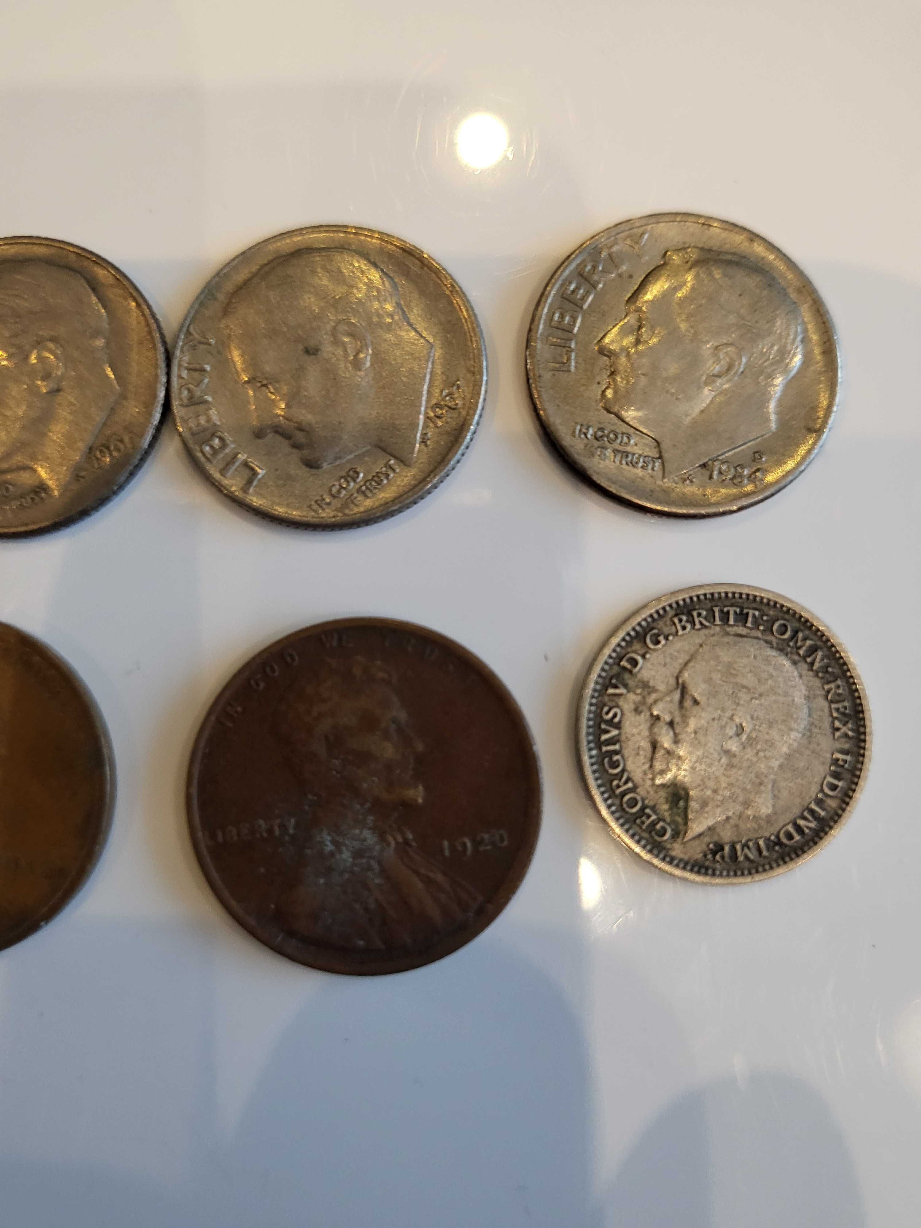 monety one dime , thre pence , one dime