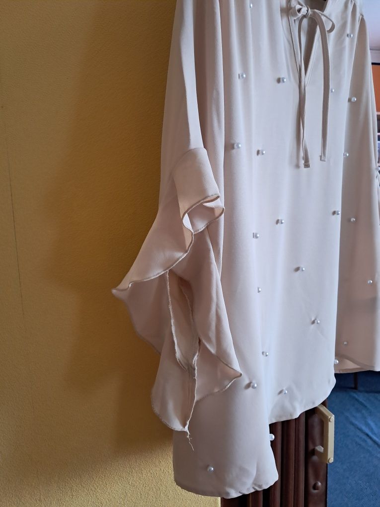 Nową bluzka beżowa rozmiar 4 xl