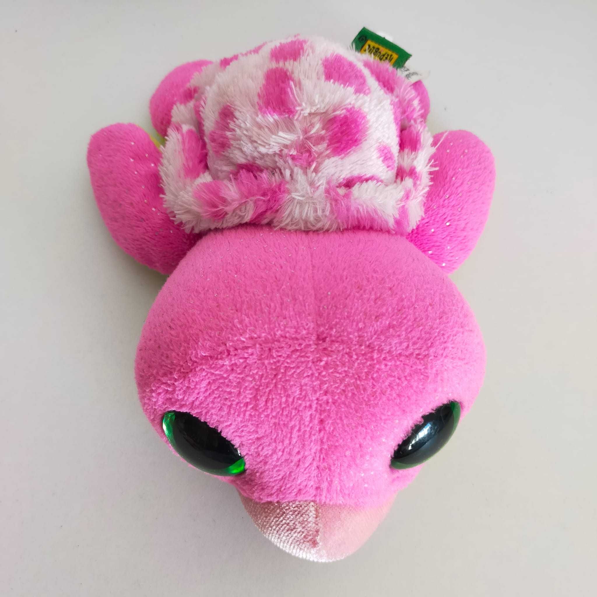 Animal de peluche tartaruga cor de rosa e verde de olhos brilhantes