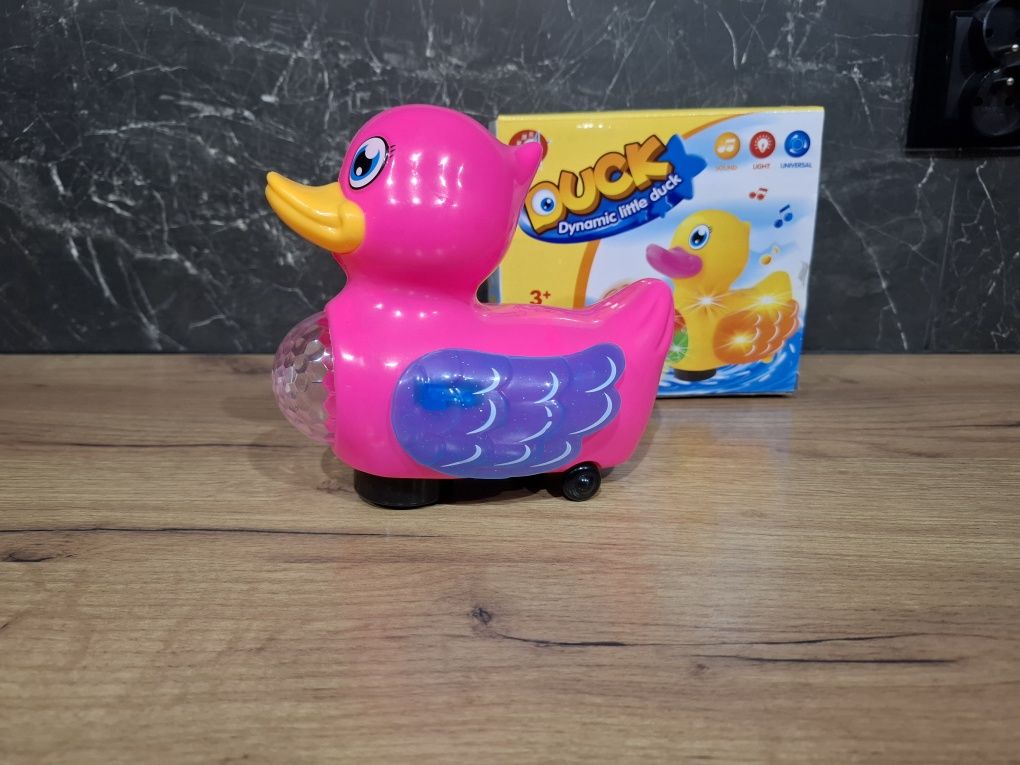 Kaczka gra świeci jeździ różowa dla dzieci