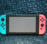 Nintendo Switch + jogo + acessórios + bolsa de transporte