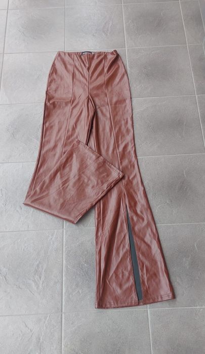 Spodnie skórzane eko skóra latex szerokie nogawki rozcięcia S 36 Nowe