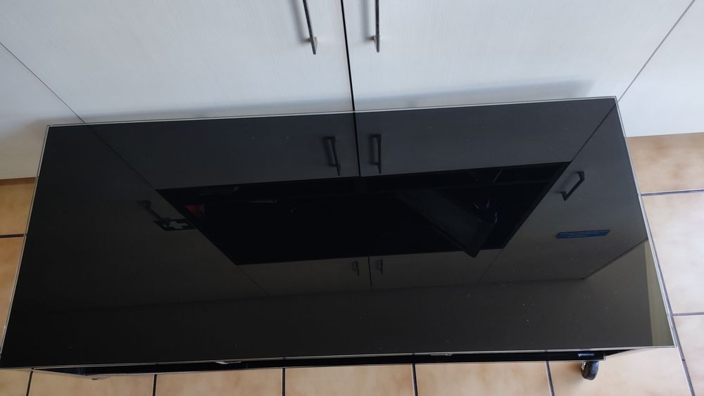 Mesa de vidro preto e cromado
