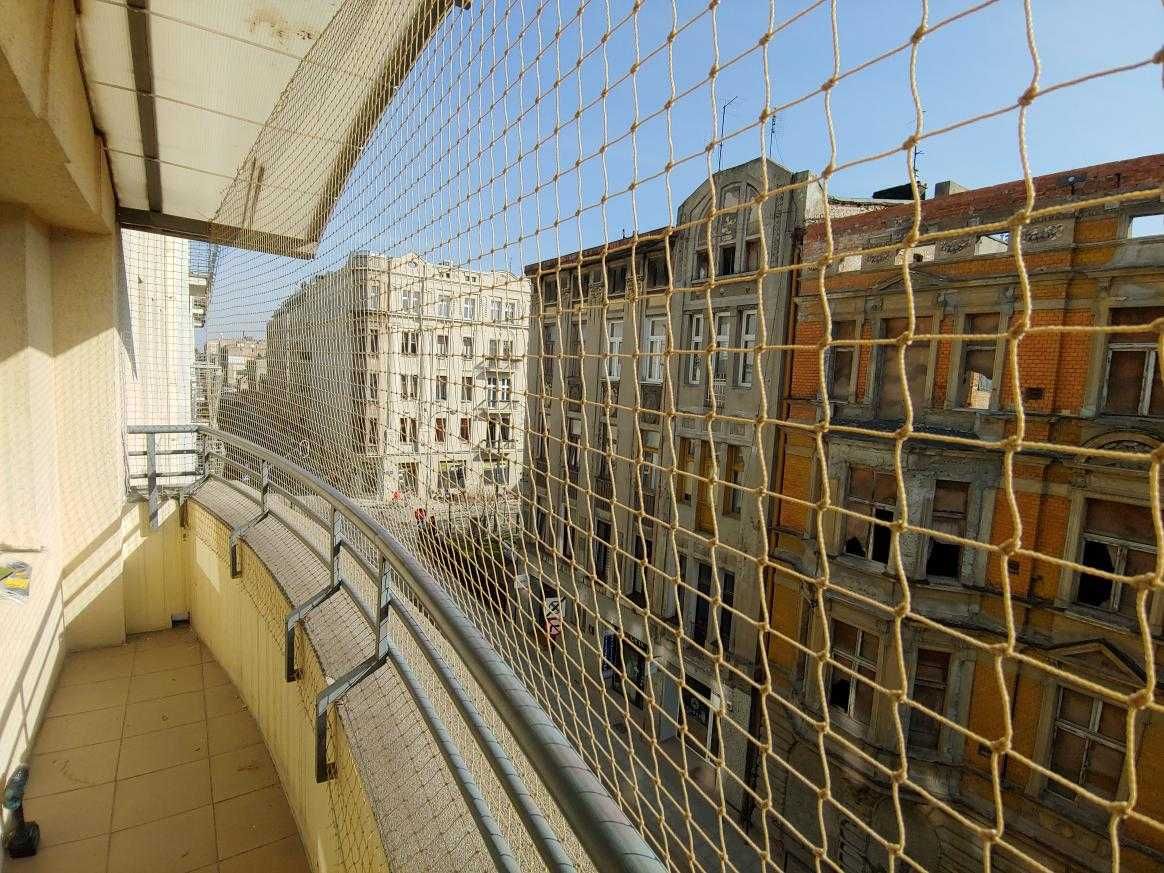 Montaż siatki na balkon przeciw gołębiom dla kota sprzątanie balkonów