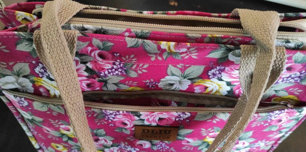 Bolsa nova em tecido com fecho