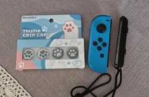 Joy con z nową baterią nakładkami na analogi i paskiem Nintendo Switch