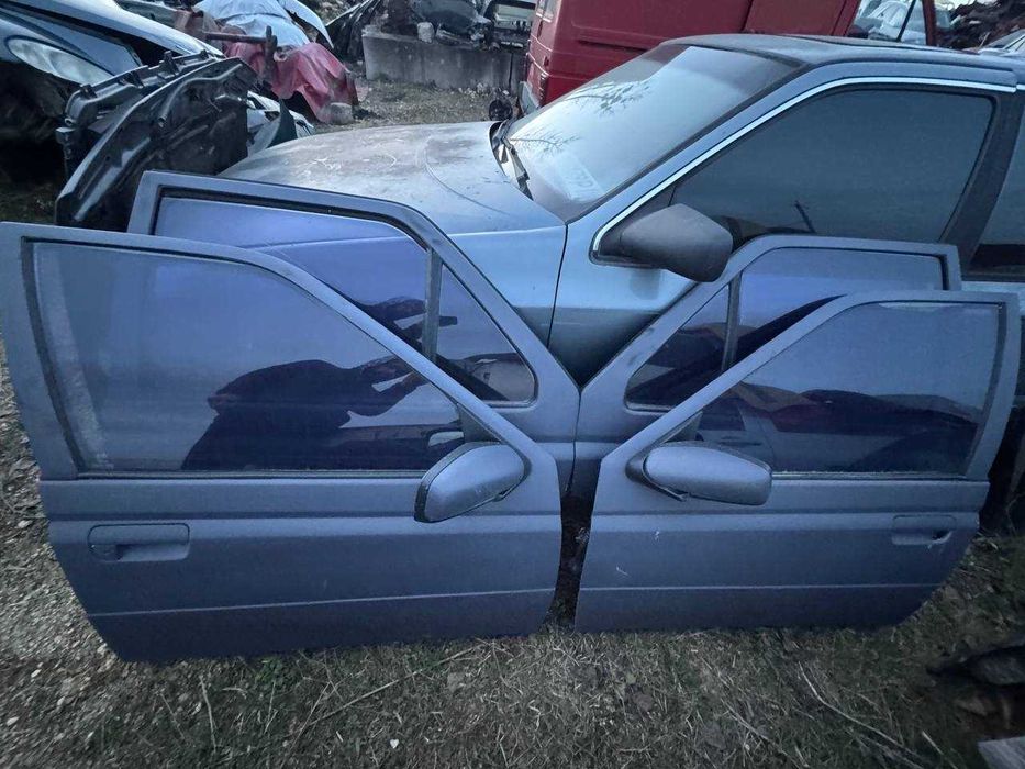 Двері в зборі до Peugeot 605 (ціна за шт.)